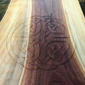 close-up of a Celtic "Shield" knot hand carved into a piece of Black Walnut