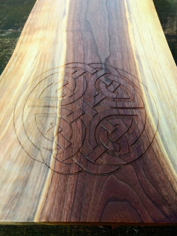 close-up of a Celtic "Shield" knot hand carved into a piece of Black Walnut