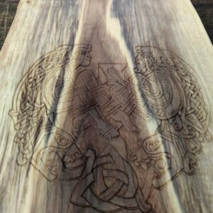 Viking celebration knot carved into a black walnut charcuterie board