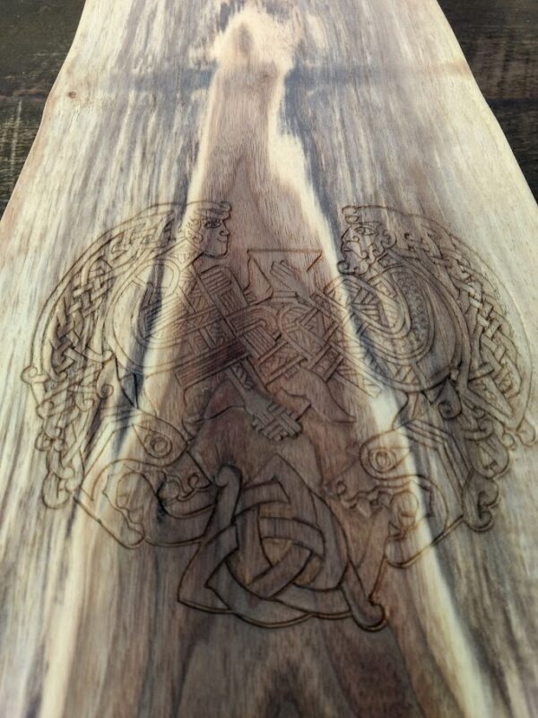 Viking celebration knot carved into a black walnut charcuterie board