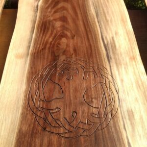 The carving of the Tree of Life is set into a piece of Black Walnut