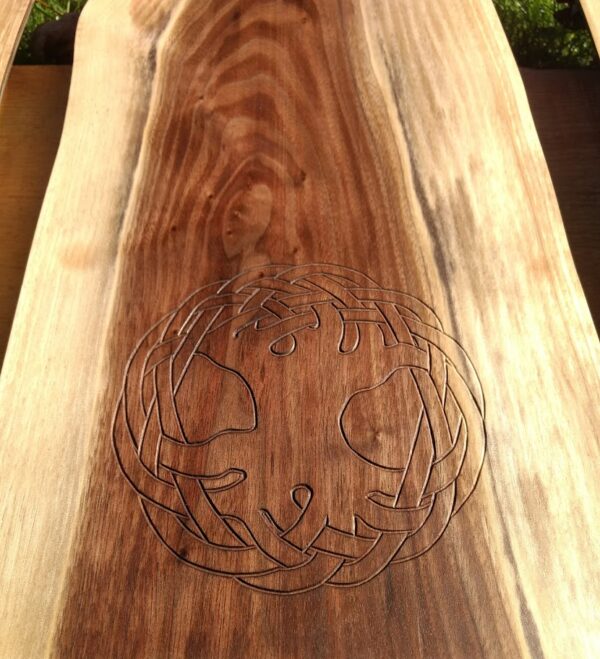 The carving of the Tree of Life is set into a piece of Black Walnut