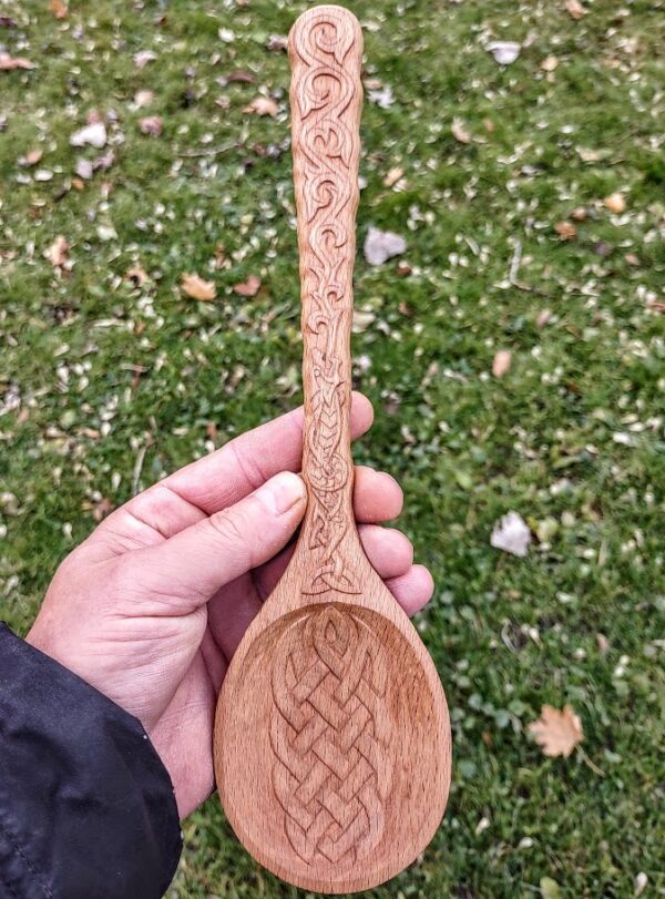 celtic fire wrym hand carved into a large beechwood